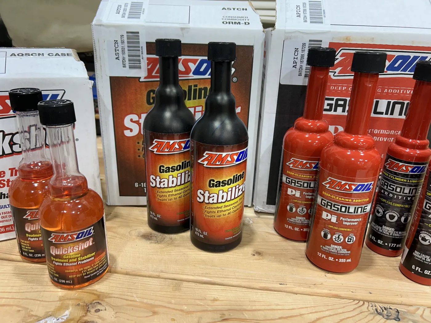 AMSOIL Gasoline Stabilizer and Quickshot bottles on the shelf
